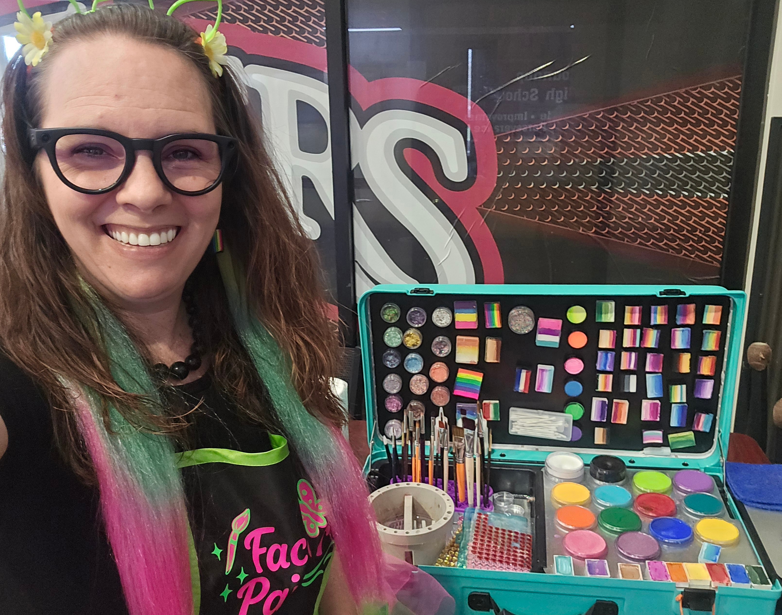 A joyful face-painting moment at an event